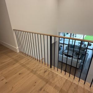 Modern White Oak Over-Post Handrail and Round Balusters