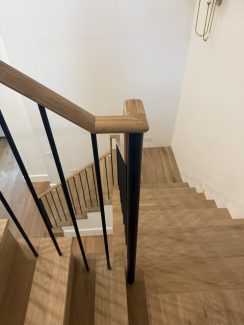 Modern White Oak Wood Over-Post Handrail and Round Iron Balusters