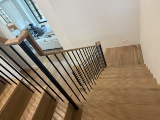 Modern White Oak Wood Over-Post Handrail and Round Iron Balusters