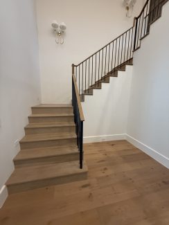 Modern White Oak Wood Over-Post Handrail and Round Iron Balusters