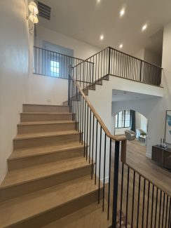 Modern White Oak Wood Over-Post Handrail and Round Iron Balusters