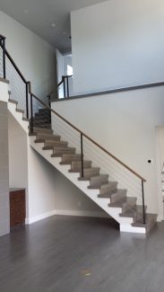 Steel Cables with Wooden Cap Rail On Free-Standing Staircase