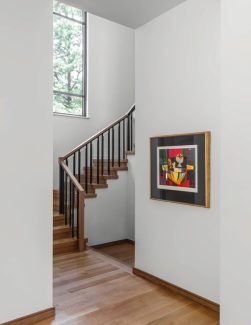 Glass Panels behind Iron Balusters with Wooden Cap Rail/Custom Wood Newel