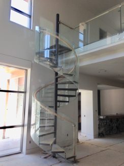 Glass Spiral Staircase With Open Risers and Steel Treads