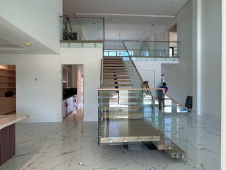 White Oak Mono-Stringer Staircase with Glass Handrail - Stair Solutions