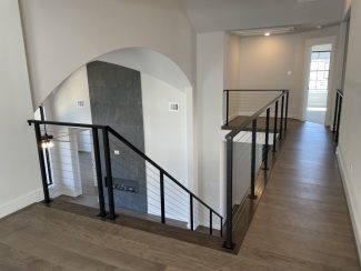 Modern Staircase Railing- Steel Cables with Iron HandrailGrand Homes - New Custom Homes in Texas
